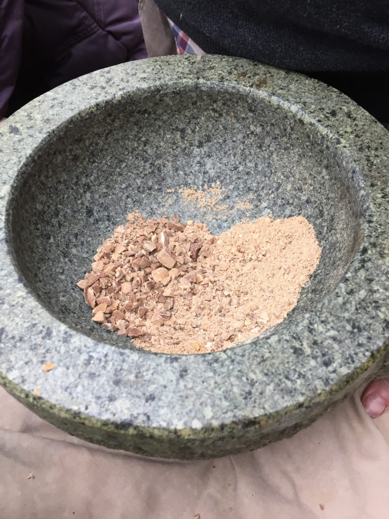 Acorns ground into flour using a mortar and pestle